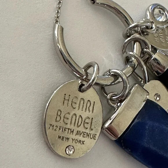 Henri Bendel  silver tone necklace with dark blue crystal and logo charms disc - Picture 8 of 9